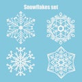 Vector set of snowflakes on a blue background. Royalty Free Stock Photo